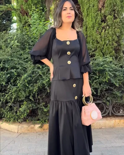 Conjunto de dos piezas negro de top peplum y falda midi