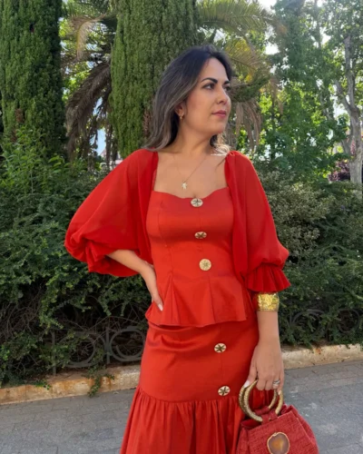 Conjunto de dos piezas naranja de top peplum y falda midi